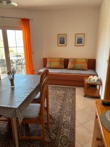 a living room with a couch and a table at Villa Maslina in Zadar