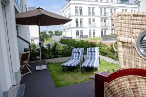Ein Garten an der Unterkunft Westendpalais 04 Strandburg