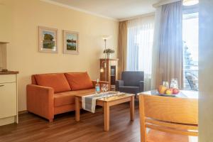 Posezení v ubytování Hafendomicil Appartement WH12 - Specht + 6 fotografií