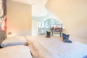 Ένα ή περισσότερα κρεβάτια σε δωμάτιο στο Ferienhaus Seestern +7 φωτογραφίες