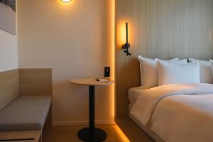 Voodi või voodid majutusasutuse NOTO Hotel toas