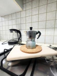 a tea kettle sitting on a counter in a kitchen at Mamma Casa Panna in Rimini