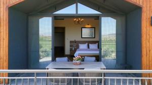 Ένα ή περισσότερα κρεβάτια σε δωμάτιο στο Les Bungalows