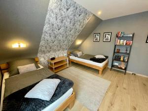 Postel nebo postele na pokoji v ubytování Haus Lotusblüte