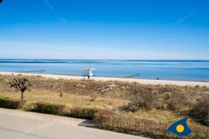 a view of a beach with the ocean in the background at Strandvilla DG in Bansin