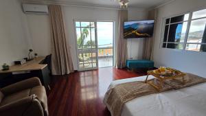 Giường trong phòng chung tại Santa Maria Villa