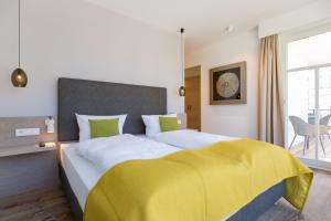 Ein Bett oder Betten in einem Zimmer der Unterkunft Beachhouse Bansin, App. 06