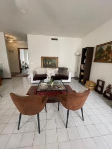 a living room with a couch and a table at Casa Aurora in Borgoforte