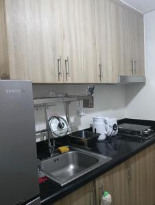 Kuchyň nebo kuchyňský kout v ubytování Staycation by ben + 10 fotografií