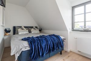 Ένα ή περισσότερα κρεβάτια σε δωμάτιο στο Ozeanblau