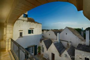 a view of a city from a balcony of a building at Masseria Luco in Martina Franca