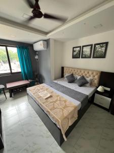 Ένα ή περισσότερα κρεβάτια σε δωμάτιο στο Auraville Homestay