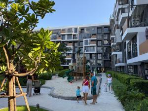a group of people walking around a playground at Skypark Laguna Phuket in Bang Tao Beach