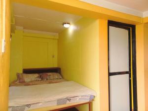 Letto o letti in una camera di Swastik Guest House