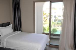 Postel nebo postele na pokoji v ubytování Dominium Residence