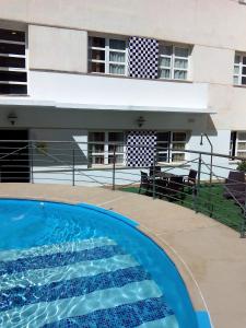 a swimming pool in front of a building at Hotel Ciudad de Cazorla in Cazorla