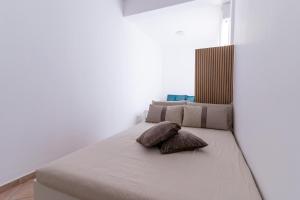 Ένα ή περισσότερα κρεβάτια σε δωμάτιο στο Appartamento Deluxe Eclissi sul MARE 30mt dal mare