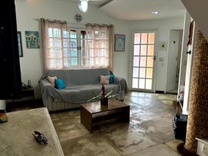 a living room with a couch and a coffee table at Sol & Aconchego Paraty in Paraty +56 photos
