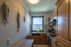 Kuchyň nebo kuchyňský kout v ubytování Hafenhaus Anglerdomizil