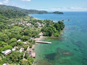 an aerial view of a small island in the ocean at CocoMar Hostal in Acanti