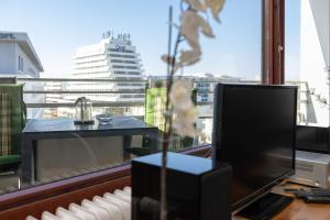 Televiisor ja/või meelelahutuskeskus majutusasutuses Grömitz-Center Whg 651 +20 fotot