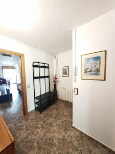 a living room with white walls and a tile floor at Casa Joana in Canyelles +33 photos