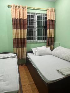 Postel nebo postele na pokoji v ubytování Local point homestay + 7 fotografií