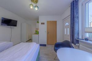 Postel nebo postele na pokoji v ubytování Hafenhaus Unterwasserwelt