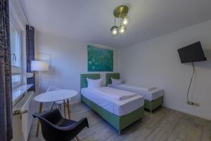 Postel nebo postele na pokoji v ubytování Hafenhaus Unterwasserwelt