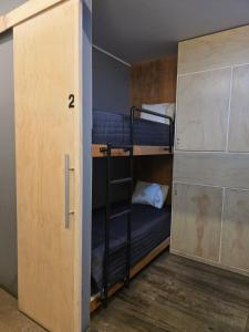 a couple of bunk beds in a room at sabina nuevo aeropuerto x12 in Lima