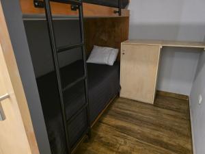 a small room with a bunk bed and a shelf at sabina nuevo aeropuerto x12 in Lima