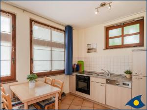 Η κουζίνα ή μικρή κουζίνα στο Villa Ricarda Whg 01 +3 φωτογραφίες