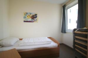 Postel nebo postele na pokoji v ubytování HP Touristik - Residenz Mühlenberg 1 + 13 fotografií