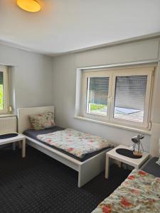 Voodi või voodid majutusasutuse Work and Stay Haus 12 Betten 2 Etagen 2 Badezimmer,Terasse Küche nähe Geleen,Geilenkirchen,Heinsberg,Alsdorf toas