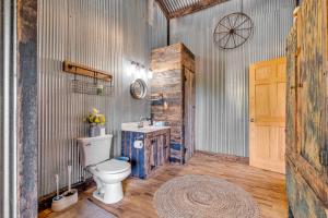 a bathroom with a toilet and a sink at Ohio Starlight Glamping Cabins - A Peaceful Woodland Retreat  +86 photos