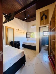 Ένα ή περισσότερα κρεβάτια σε δωμάτιο στο Ecovillage Juquehy, Chalé com 2 suítes e Mirante ao Mar