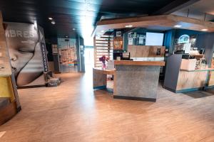 a store with a counter in the middle of a room at ibis budget Sète centre in Sète +38 photos