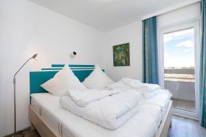 Postel nebo postele na pokoji v ubytování Grömitz-Center Whg 880