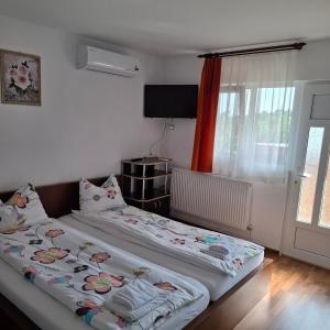 Ένα ή περισσότερα κρεβάτια σε δωμάτιο στο Casa dina