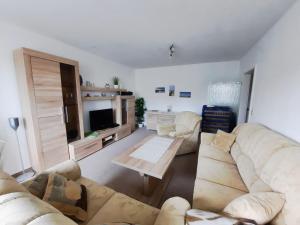 TV a/nebo společenská místnost v ubytování Langer Strand 33