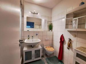 Koupelna v ubytování Langer Strand 33 + 5 fotografií