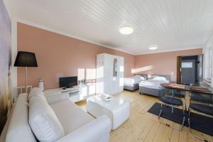 Posezení v ubytování Hafenhaus Leuchtturm + 16 fotografií