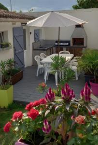 Κήπος έξω από το Studio et Mobil-home climatisé