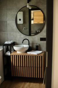 a bathroom with a sink and a mirror at Rowerowa Przystań in Milicz +18 photos