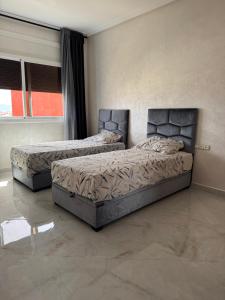 Ένα ή περισσότερα κρεβάτια σε δωμάτιο στο Manami Appartementen AlHoceima