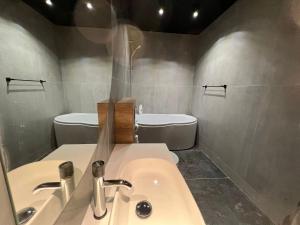 a bathroom with a sink and a toilet at NORD Up in Zalău +24 photos