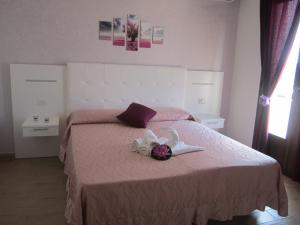 A bed or beds in a room at Tesori del Salento
