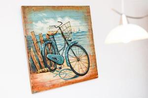 a painting of a bike next to some bats at Ferienhaus Möwenweg in Neuharlingersiel +8 photos