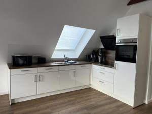 Η κουζίνα ή μικρή κουζίνα στο Ferienwohnung Hafennah +9 φωτογραφίες
