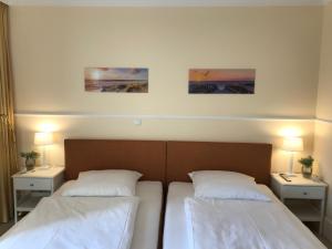 Postel nebo postele na pokoji v ubytování Ferienhaus "Strandvilla Deluxe" + 8 fotografií